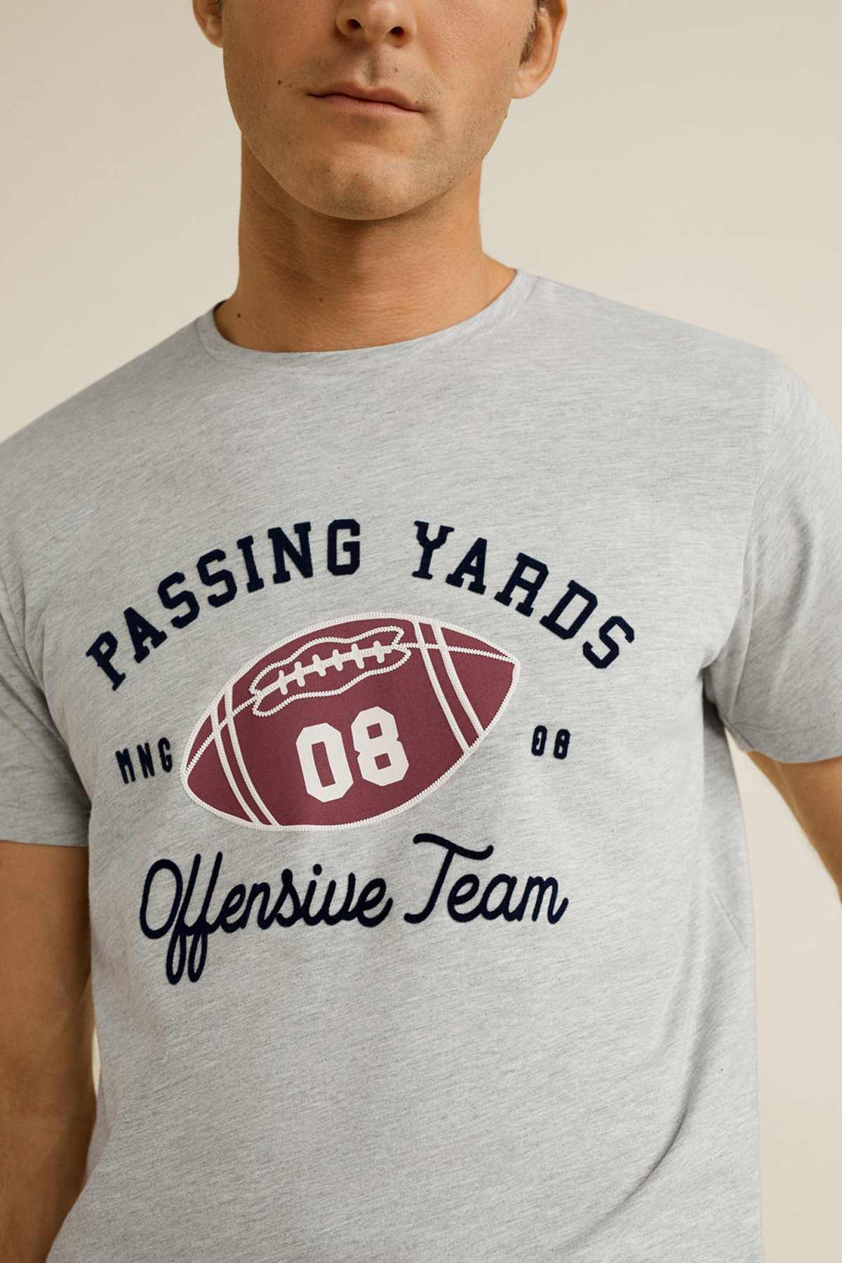 Heather grey T-shirt close-up of football graphic with “Passing Yards” and “08”