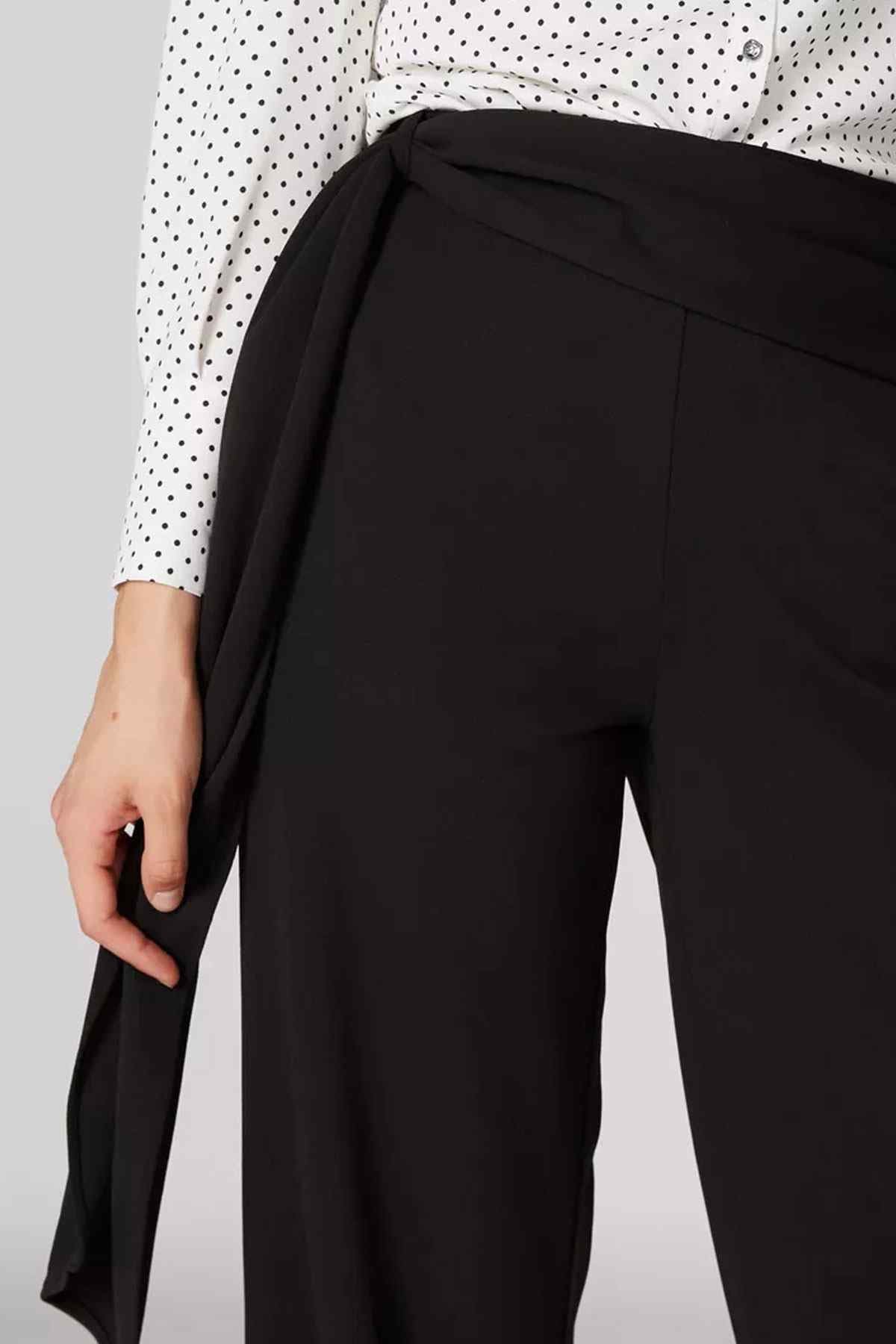 Black wide-leg pants with tailored front and smooth straight leg