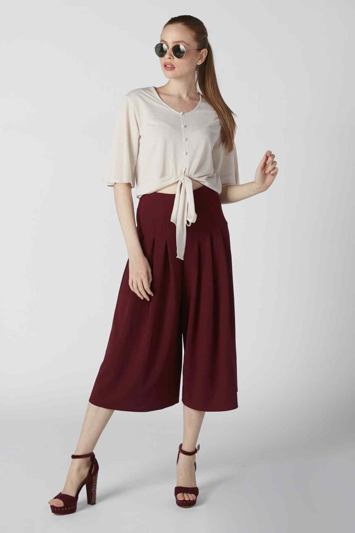 Burgundy high-waist culottes with pleated drape and wide cropped legs