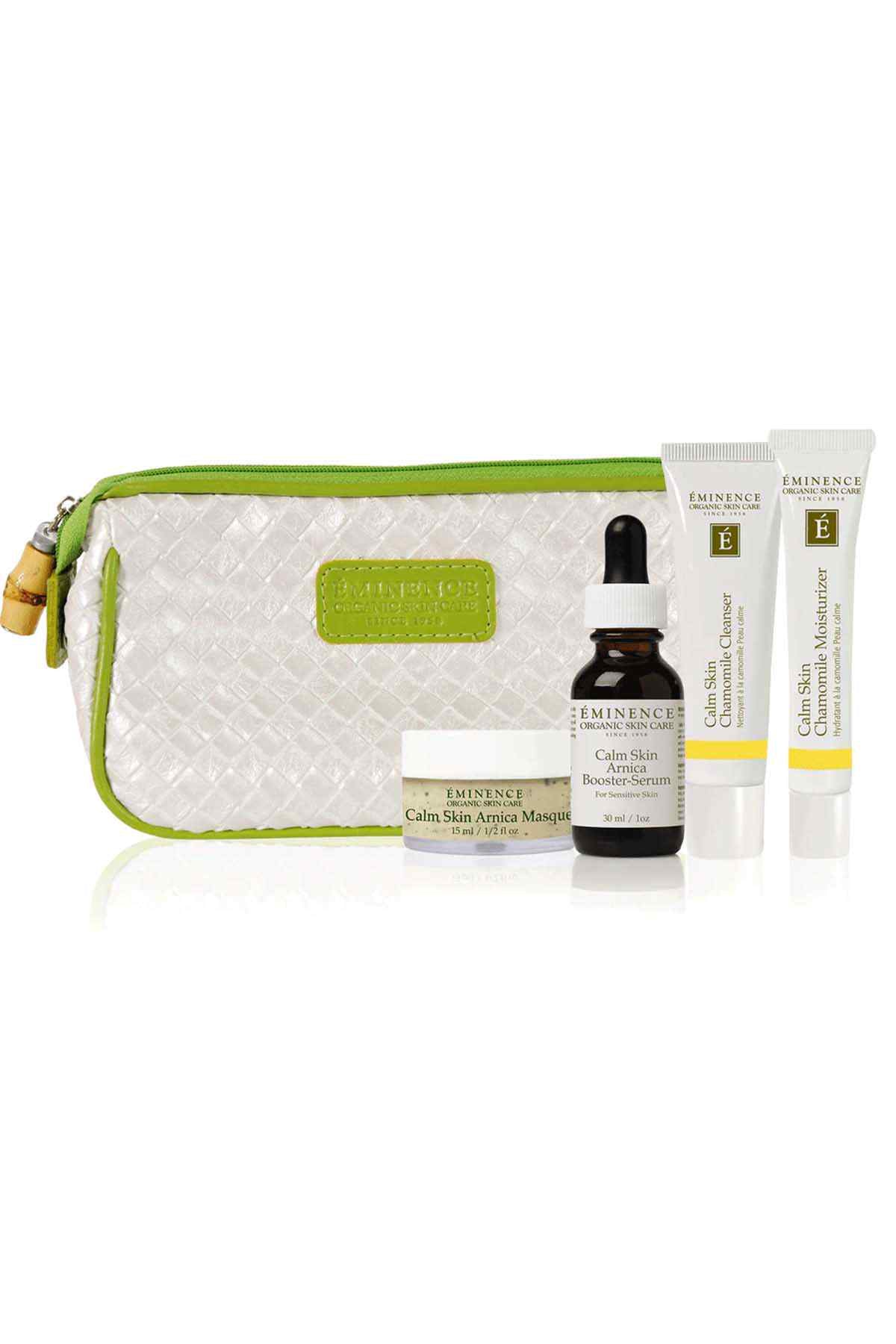 Eminence skincare set with zippered white pouch, green trim, and serum bottles