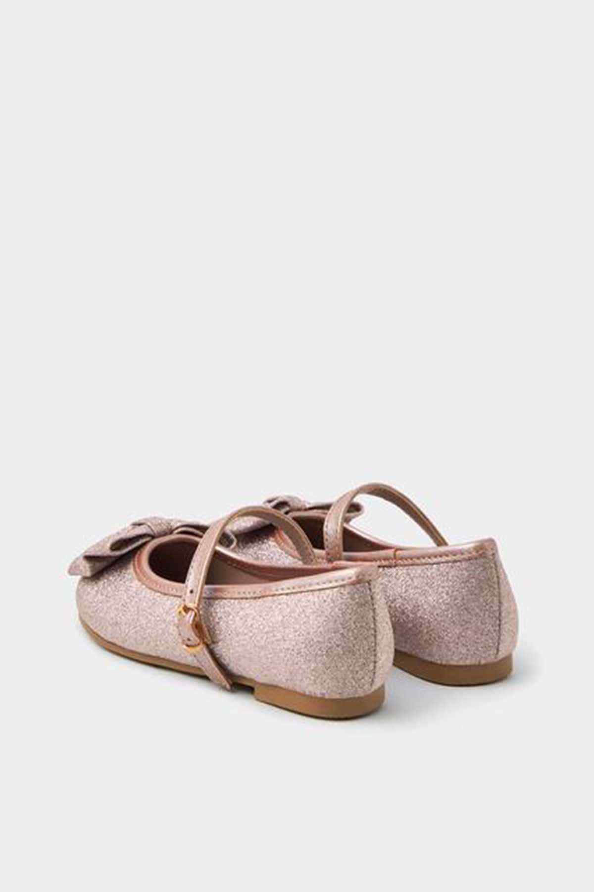 Pink glitter ballet flats with bow detail and slingback ankle strap