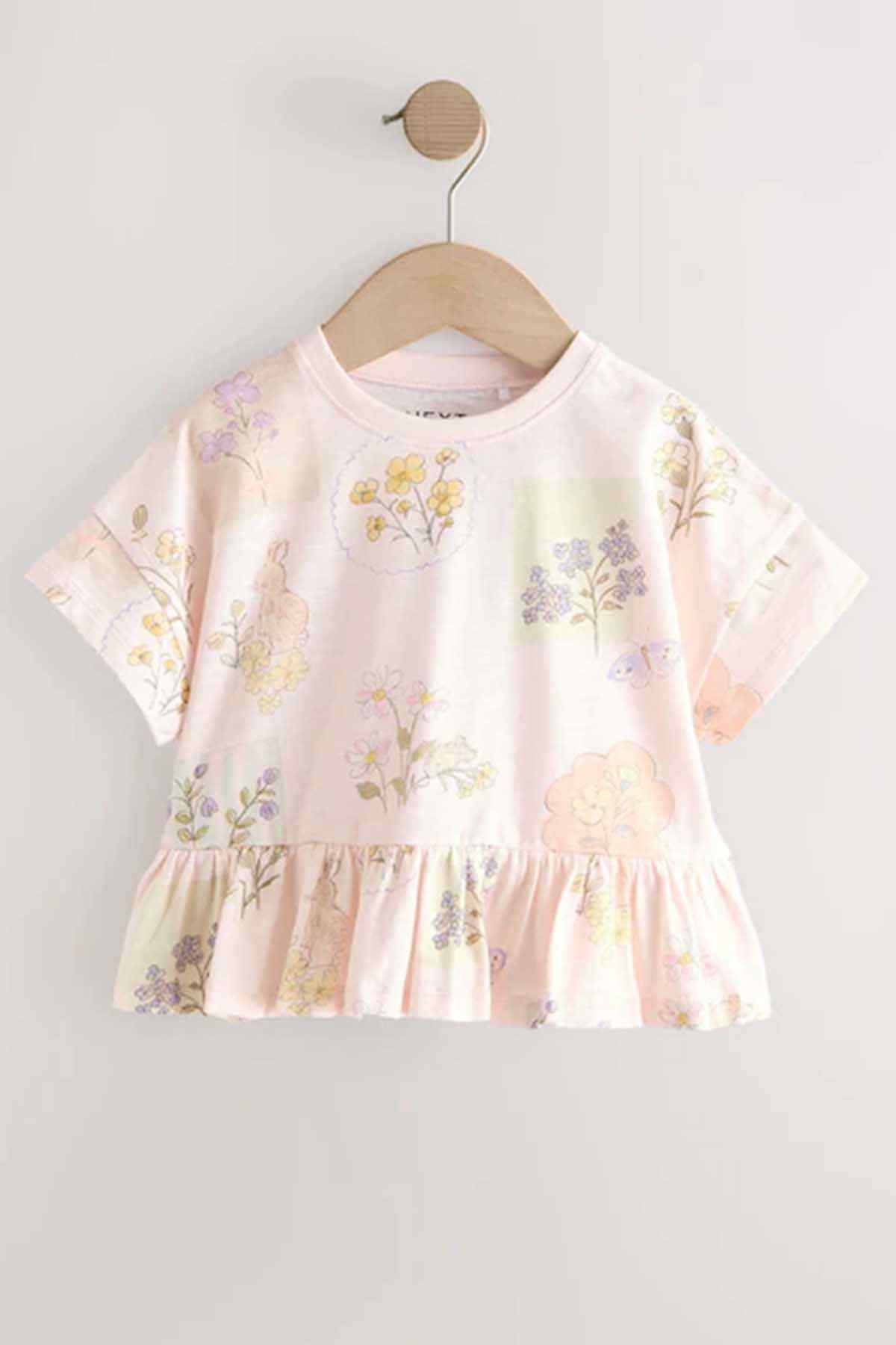 Kids' cream floral peplum T-shirt with gathered waist and short sleeves