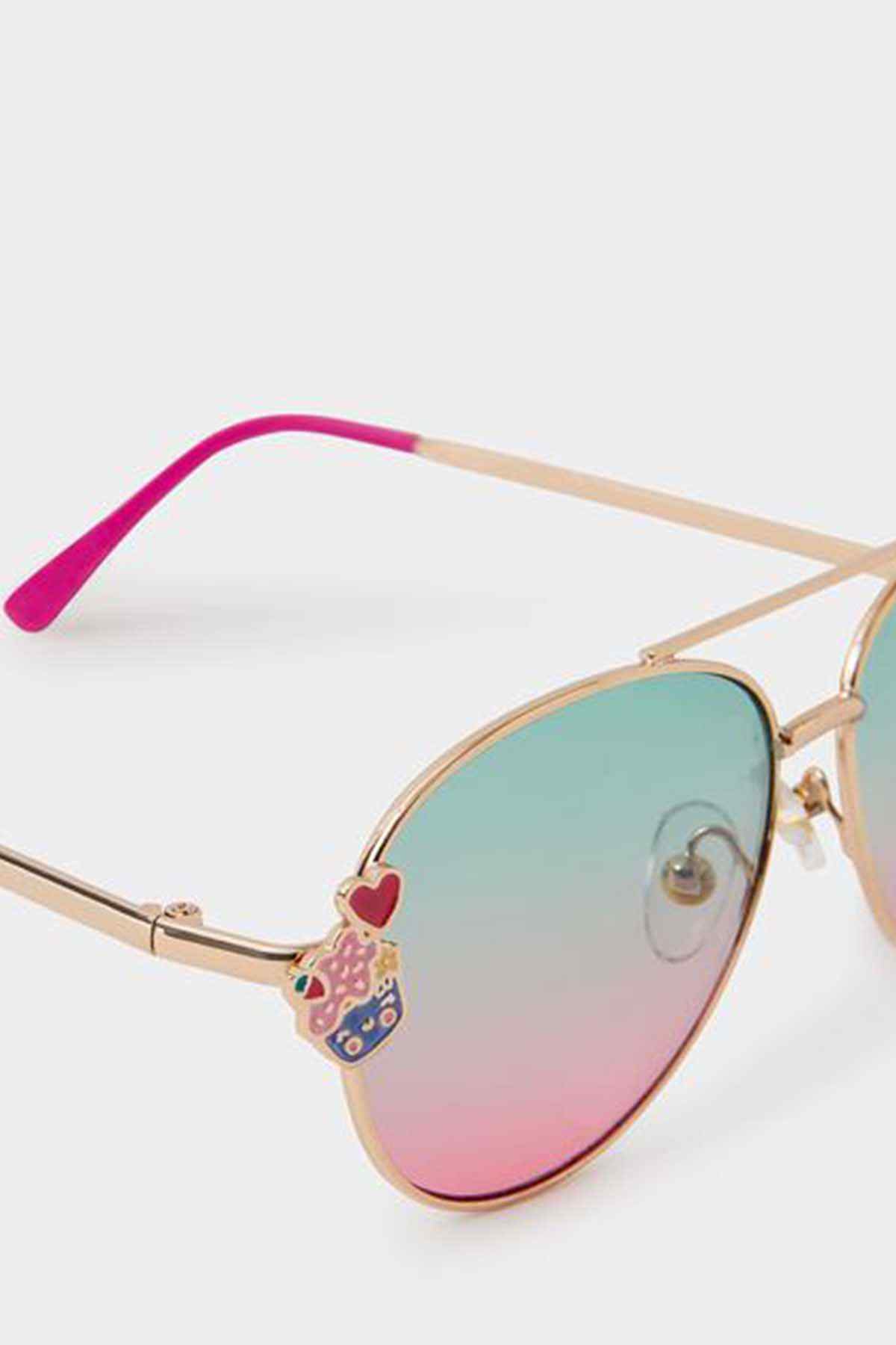 Accessorize gold-tone sunglasses with pink temples, gradient teal-to-pink lenses, heart and charm