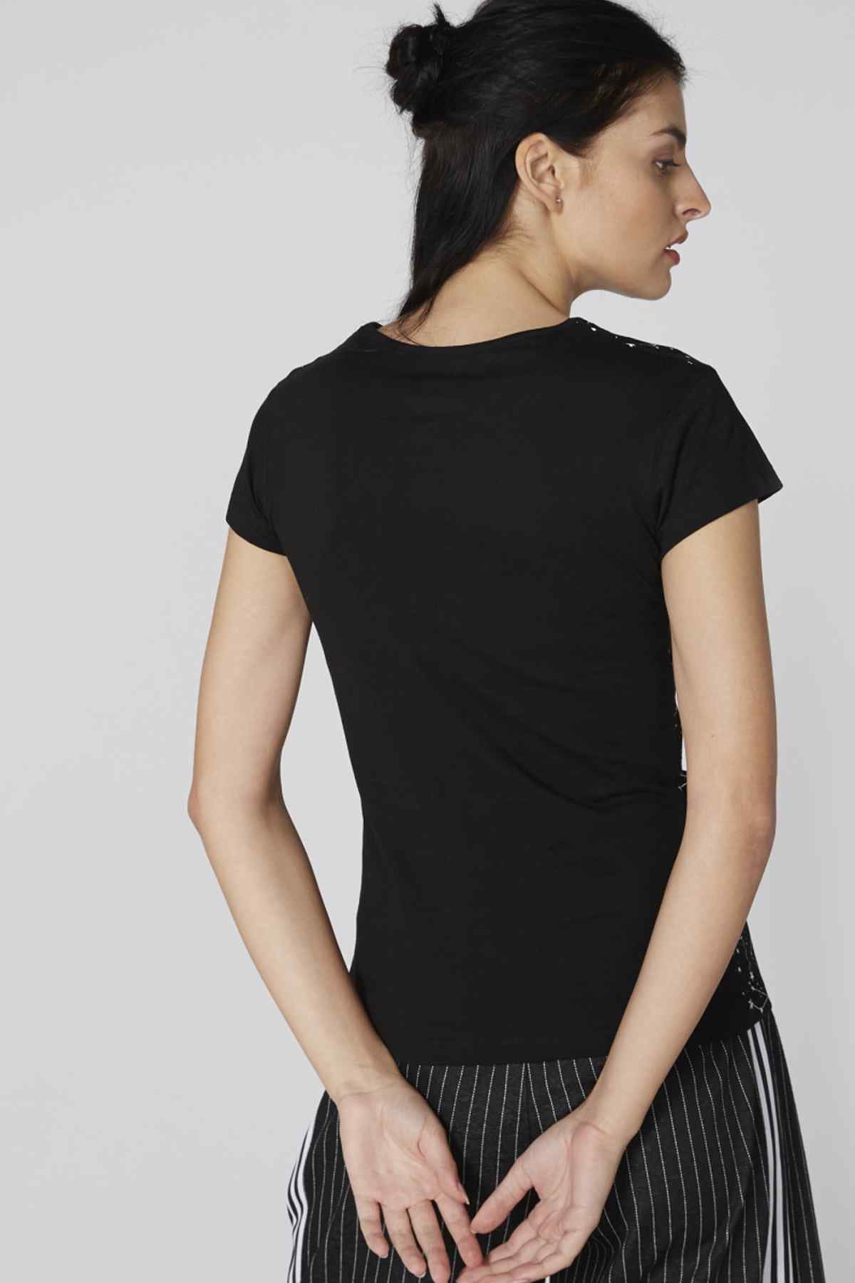 Black short-sleeve crewneck T-shirt, plain back, with striped wide-leg pants