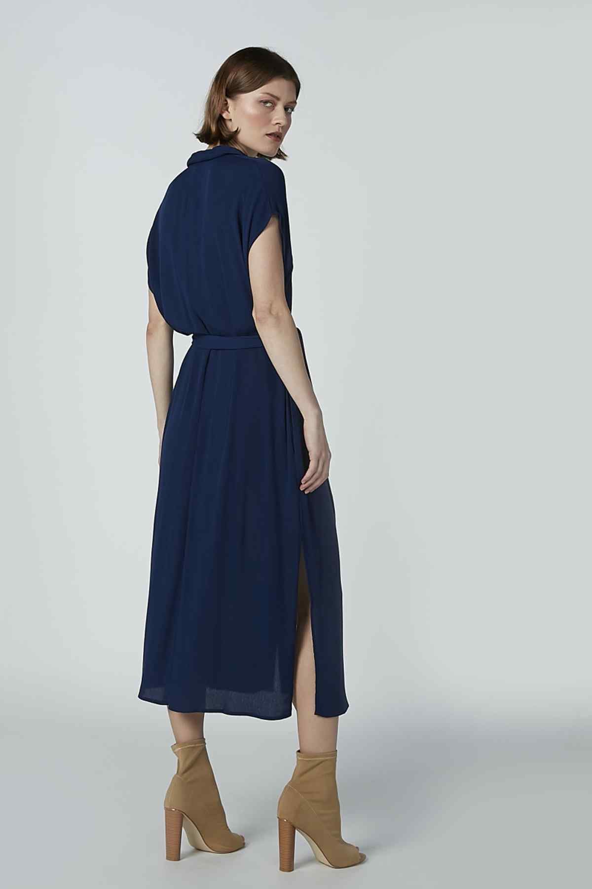 Navy button-front shirt dress with short sleeves, tied waist belt, side view, midi