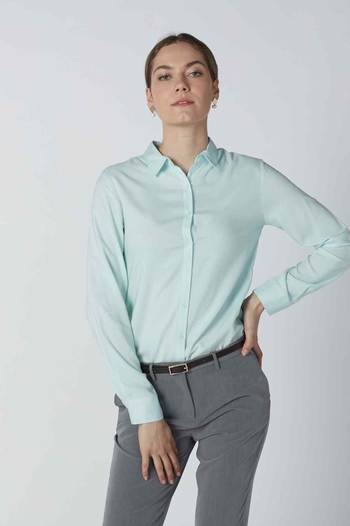 Light turquoise collared button-up shirt with long sleeves and buttoned front