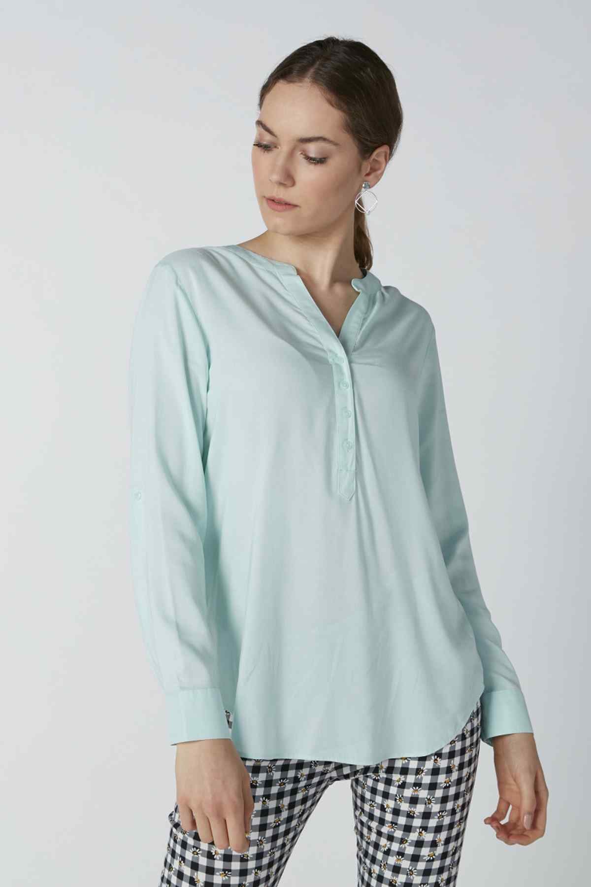 Light aqua long-sleeve button-up blouse with collar and button front