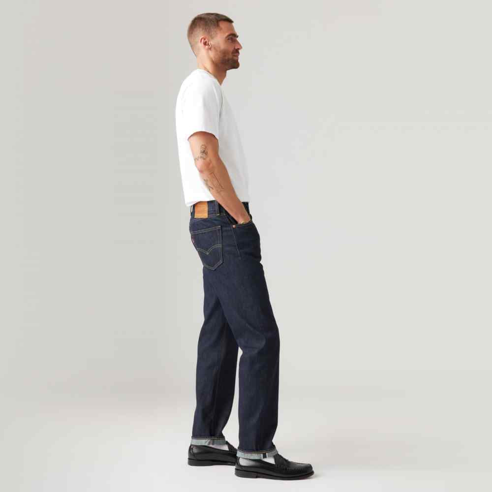 Dark wash denim jeans with straight leg and side seam, orange stitch detail