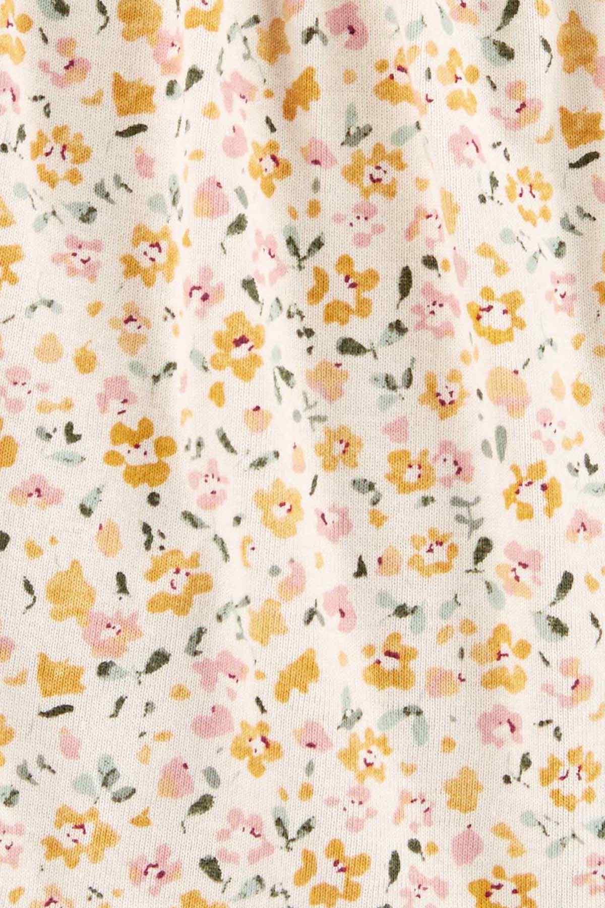 Floral print fabric close-up with soft pastel flowers and leaves