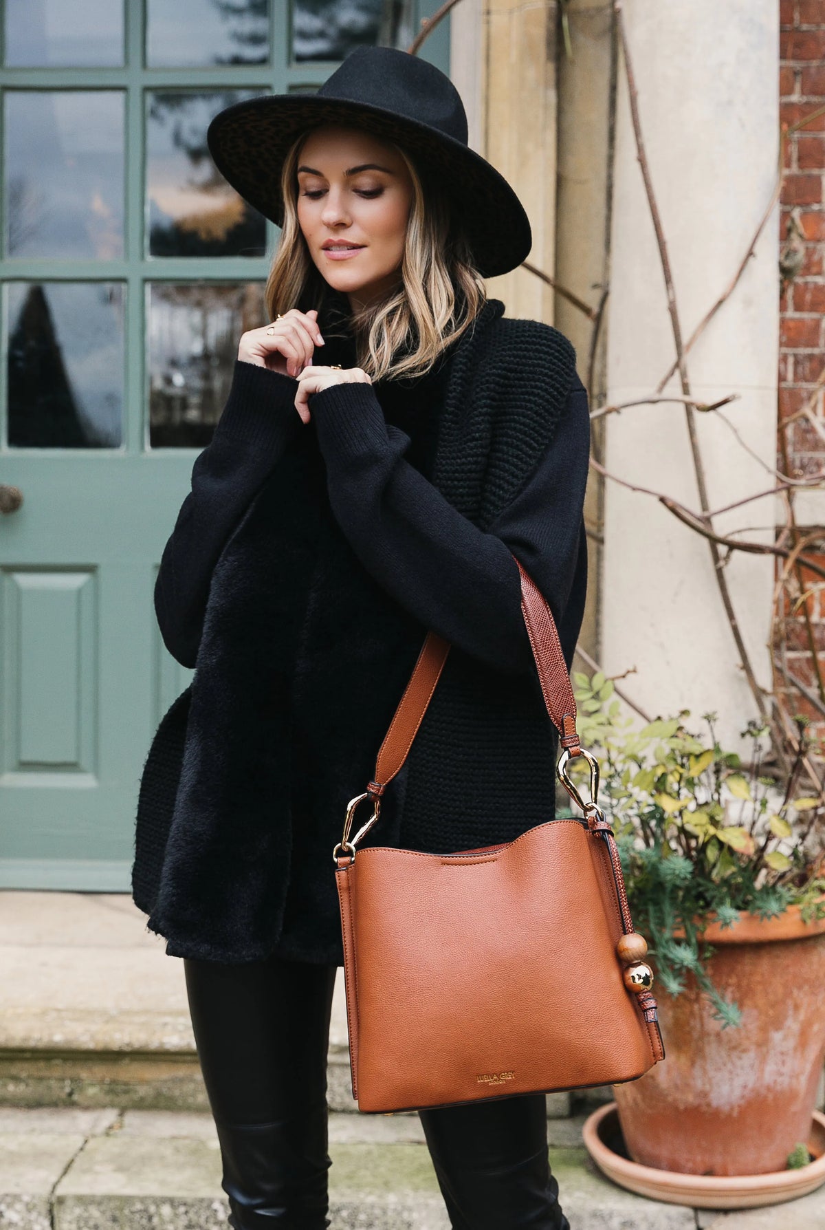 Brown shoulder bag with gold hardware and detachable strap