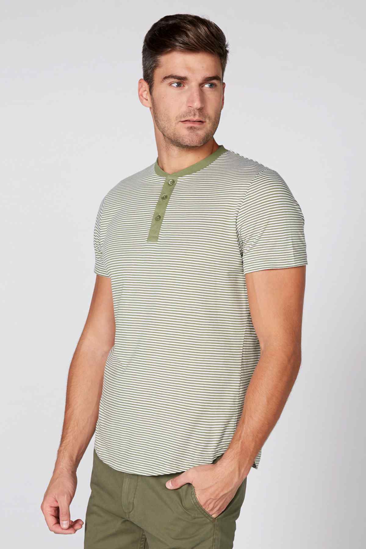 Green and white striped short-sleeve henley shirt with button placket