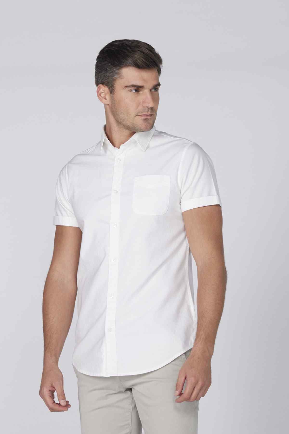 Men's white short-sleeve button-up shirt with chest pocket, side view