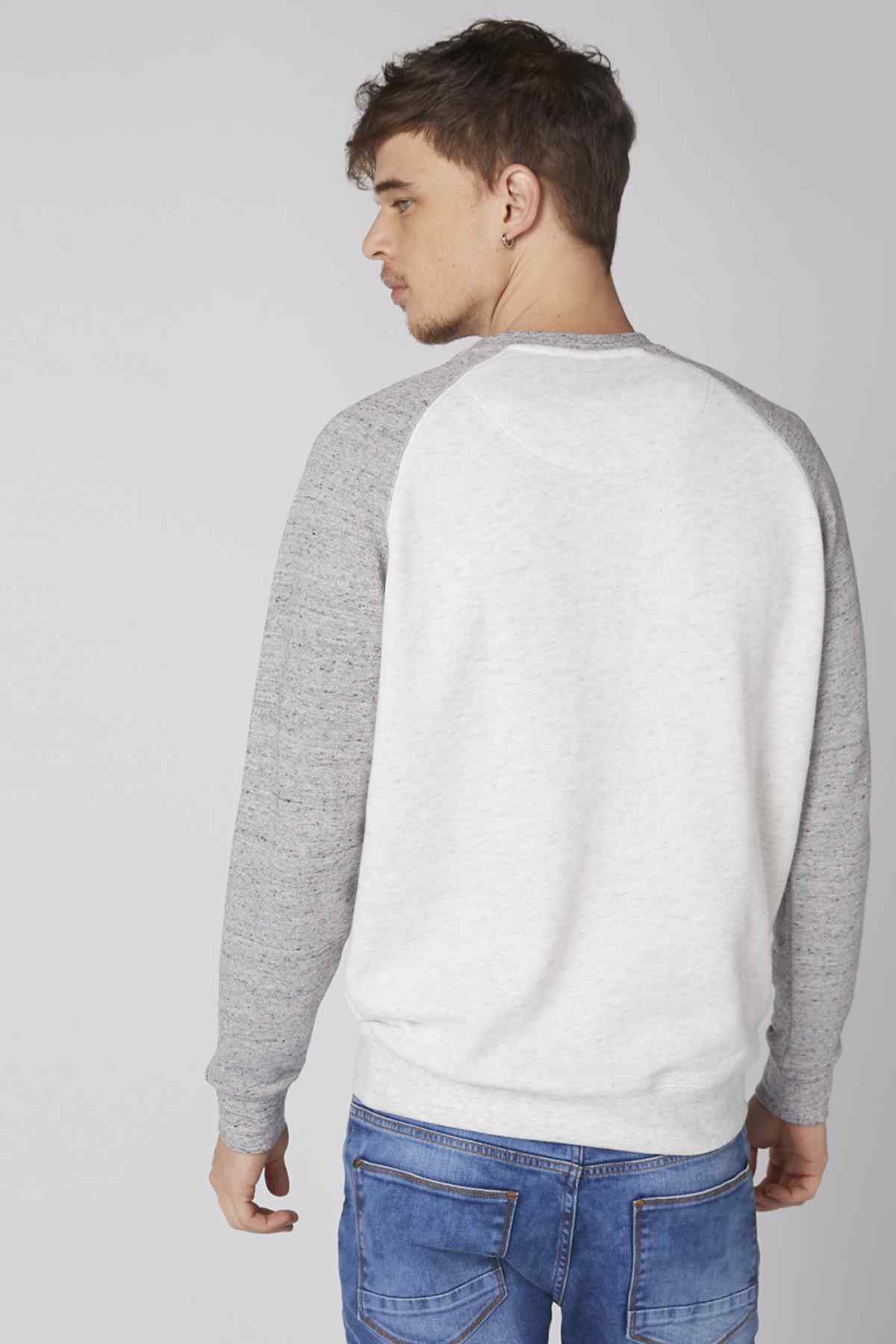 Back view of grey and white raglan sweatshirt, long sleeves and crew neck