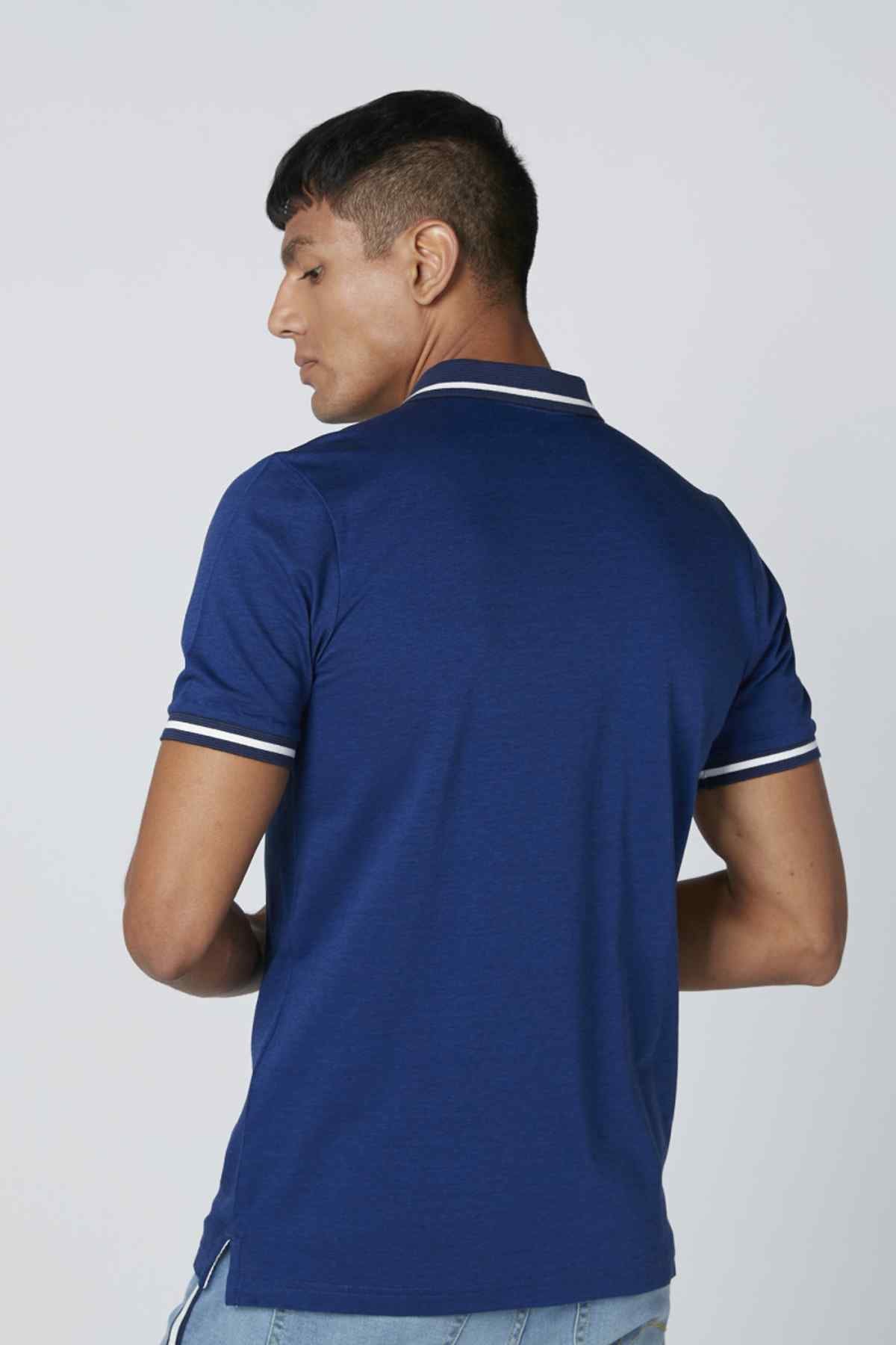 Blue polo shirt with white-trim collar and sleeve cuffs, back view.