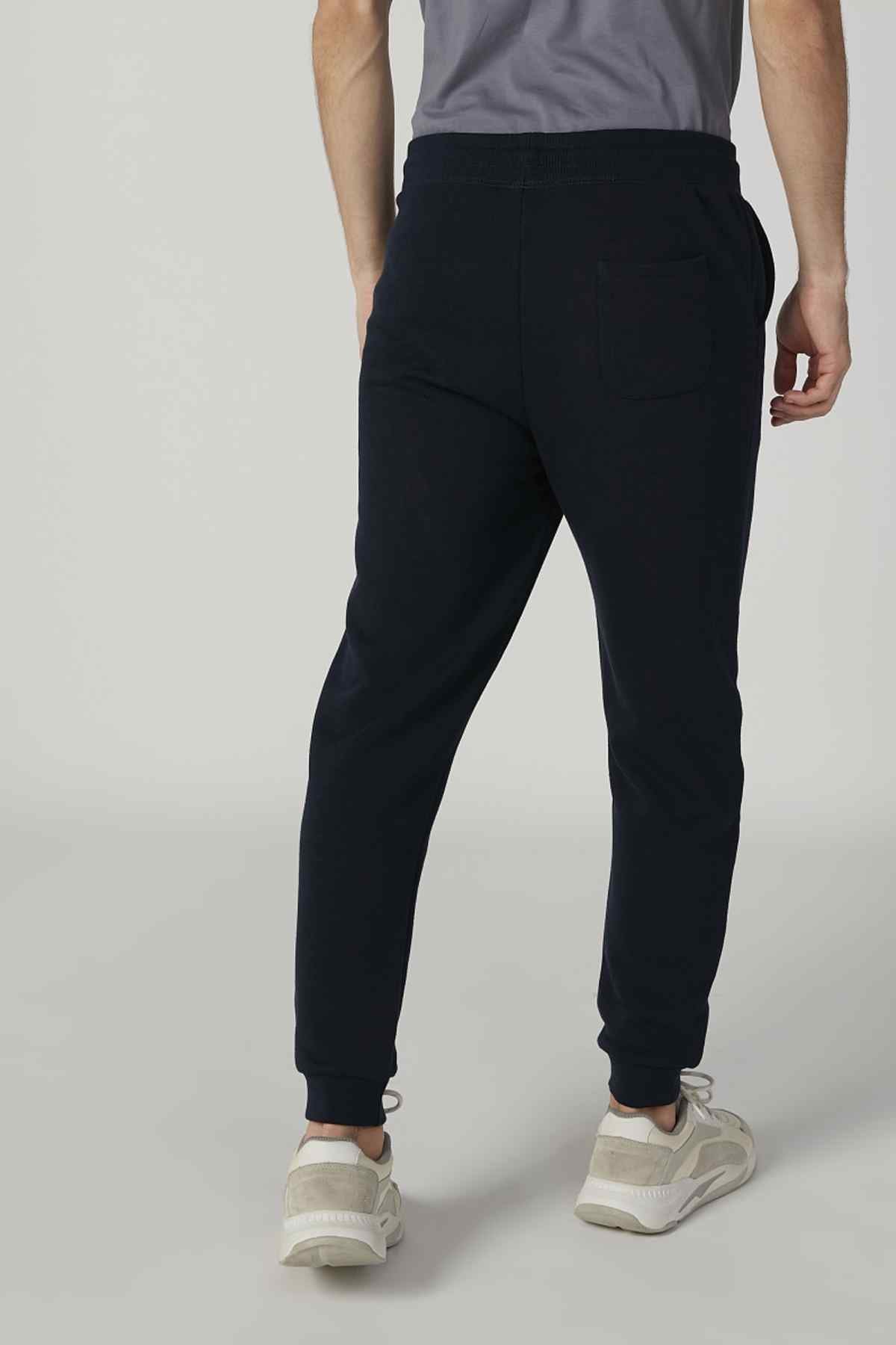 Navy jogger pants with side pockets and elastic ankle cuffs