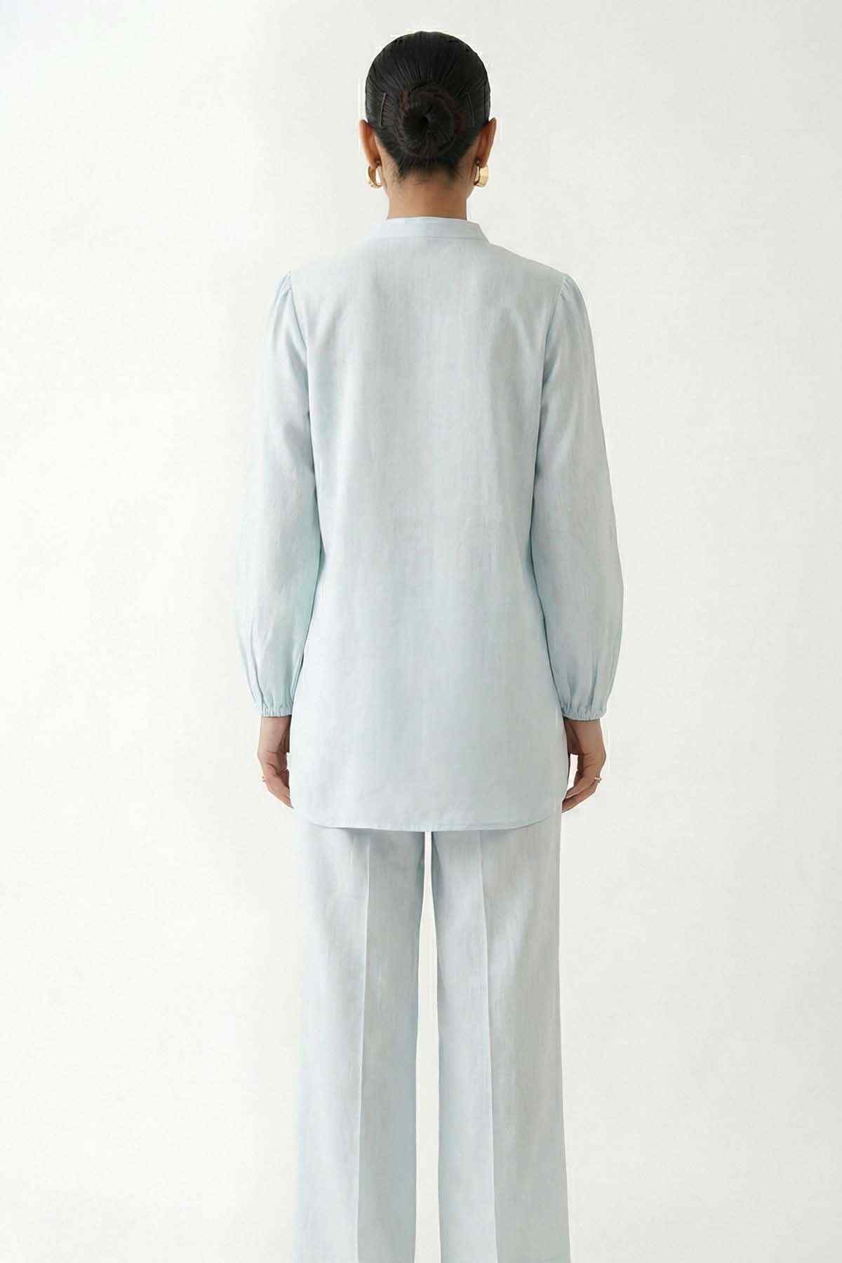 Light blue embroidered kurta and matching trousers set, back view