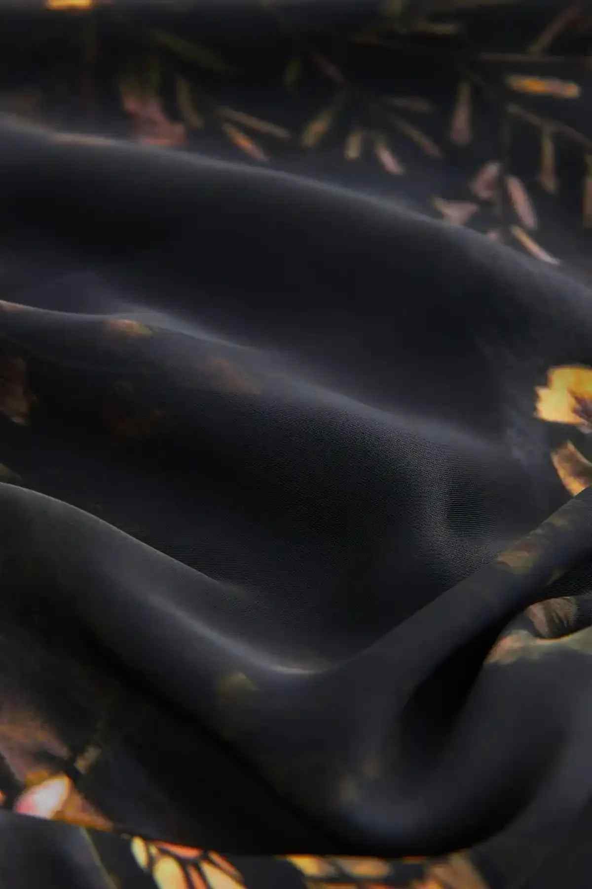 Black fabric with gold and floral print detail