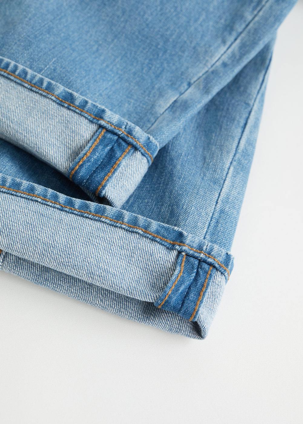 MANGO light wash denim jeans folded cuff with stitched hem detail