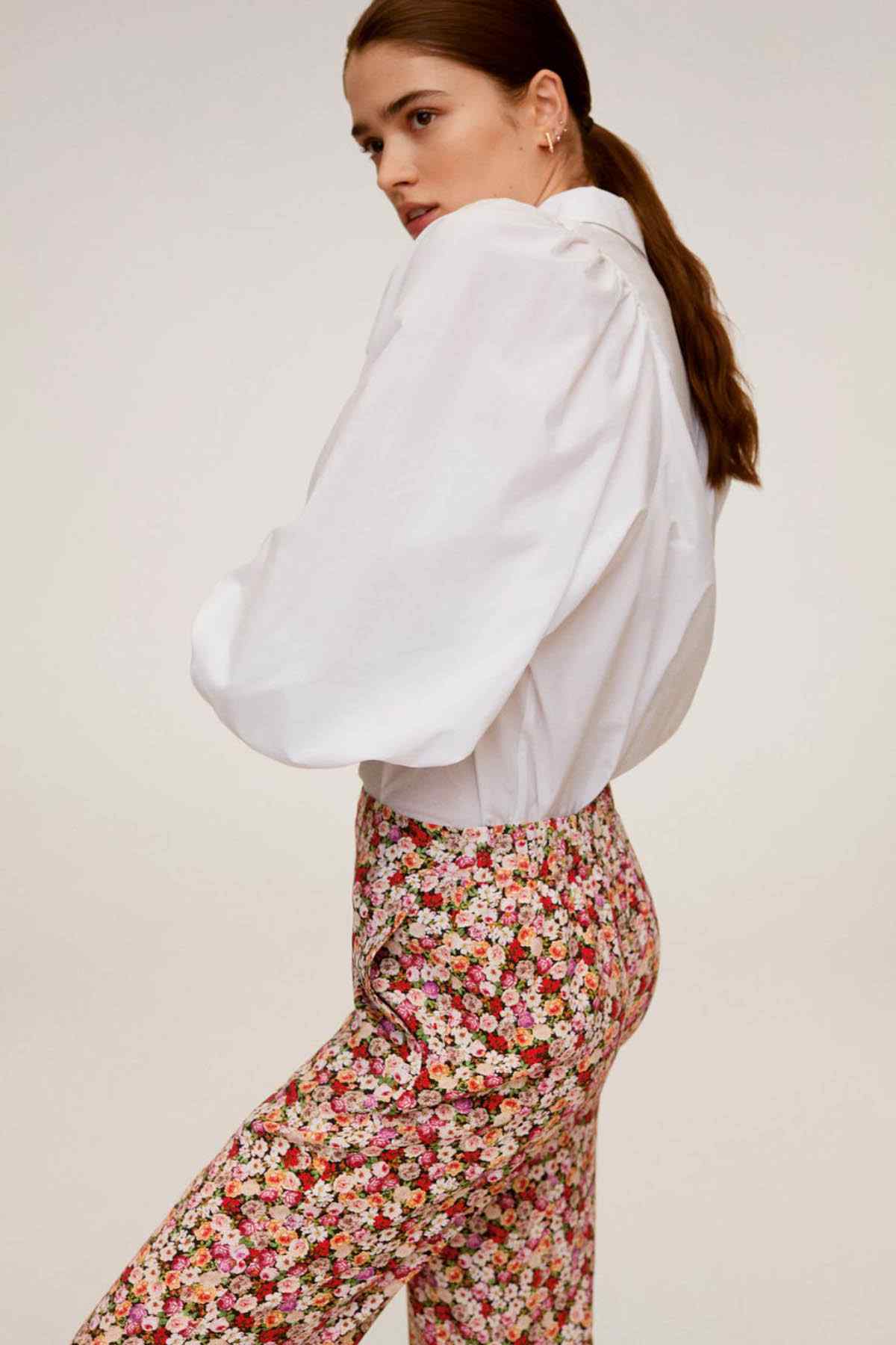 Floral print trousers with elastic waistband, back view in profile