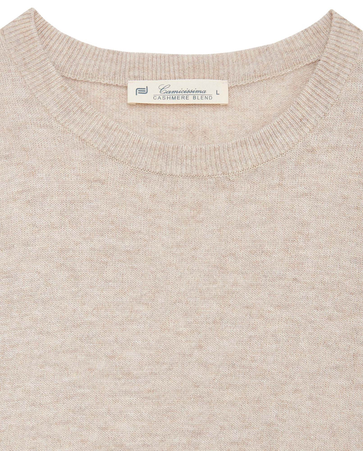 Cream knit sweater crew neck close-up with interior neck label