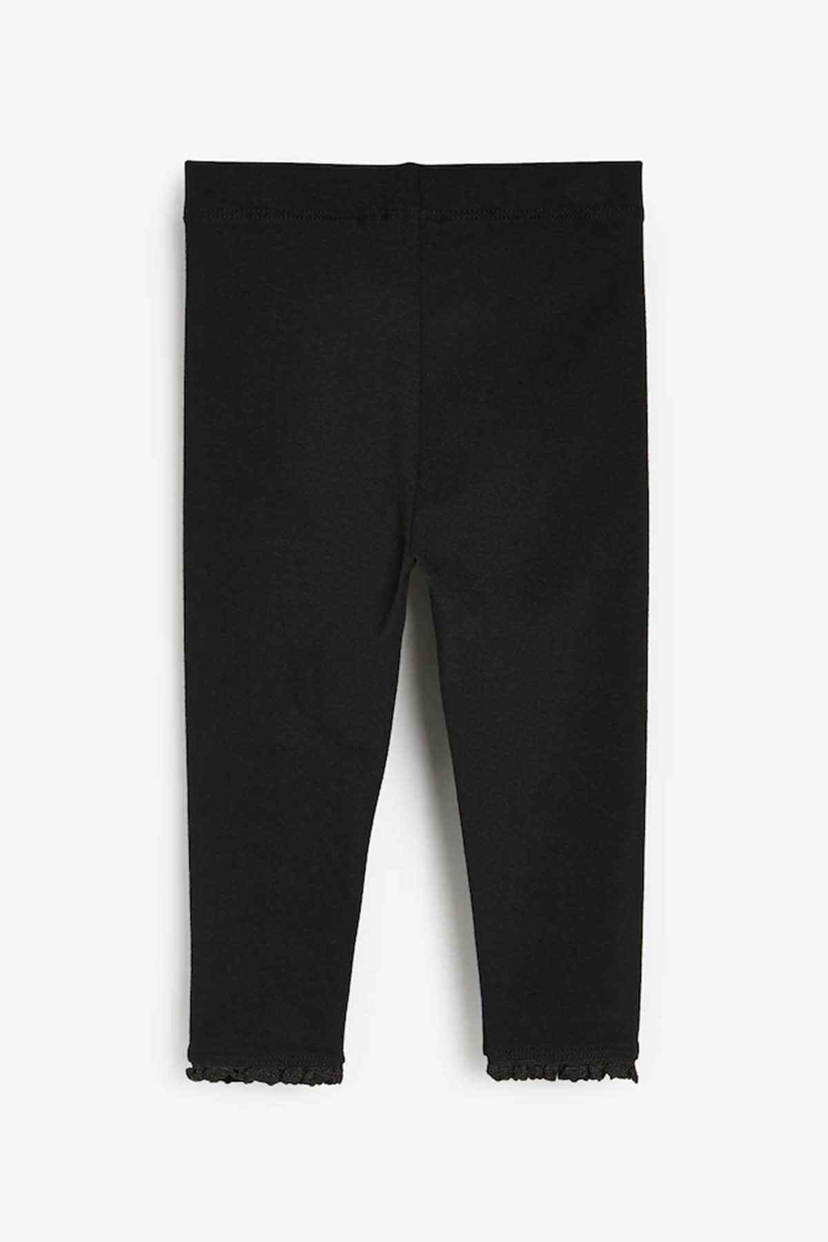 Black ankle jeans with frayed hems and slim straight fit