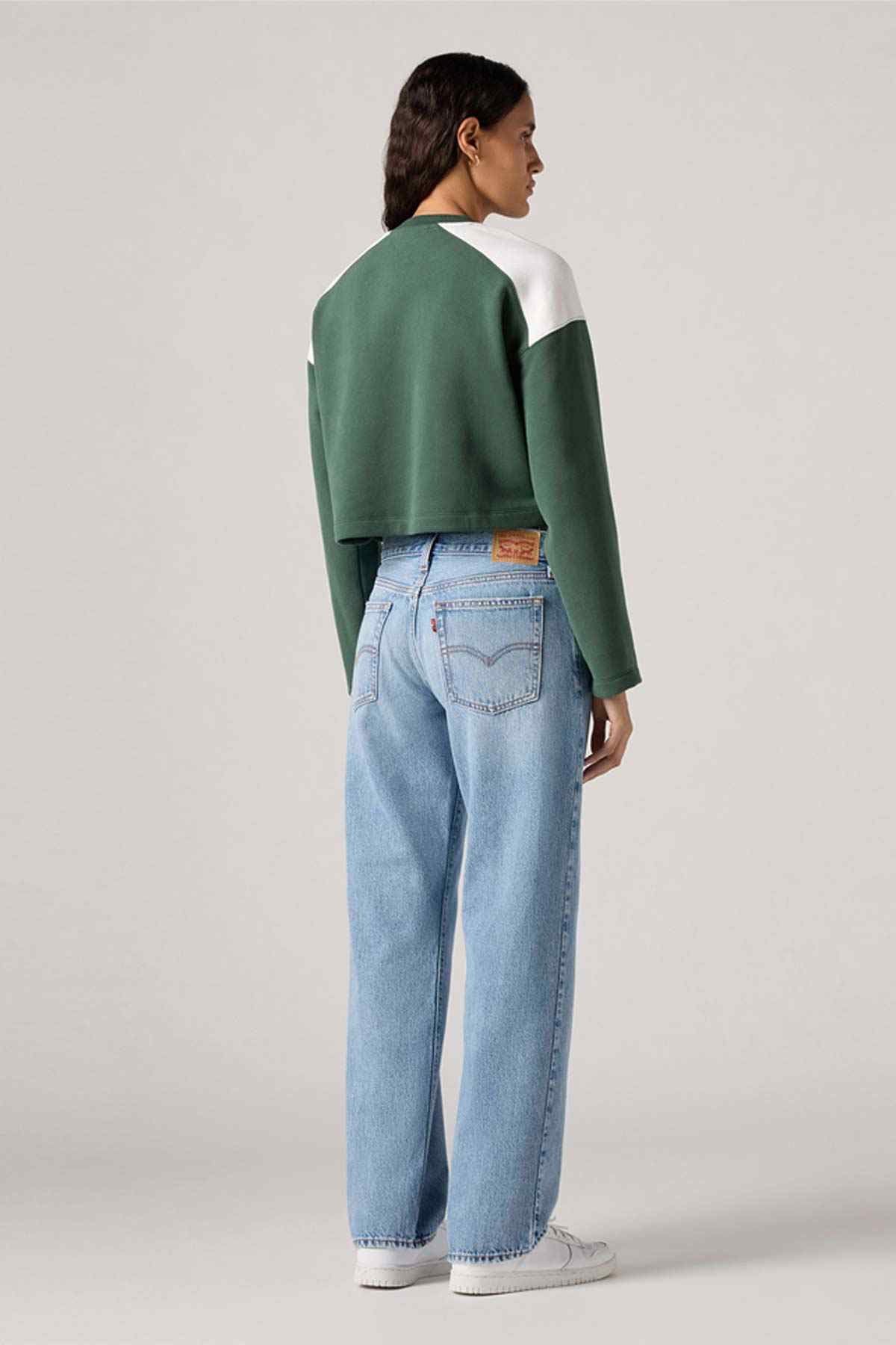 Levi's light blue denim jeans, back view with wide straight legs and back patch pocket