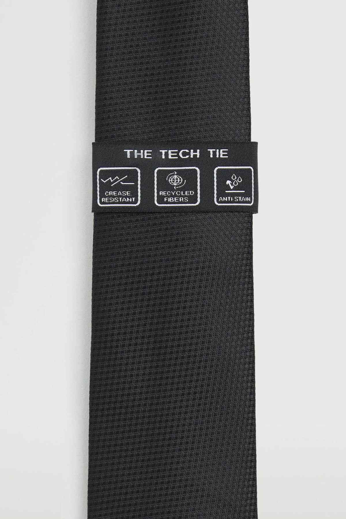 Black necktie with label “THE TECH TIE” and icons for anti-stain