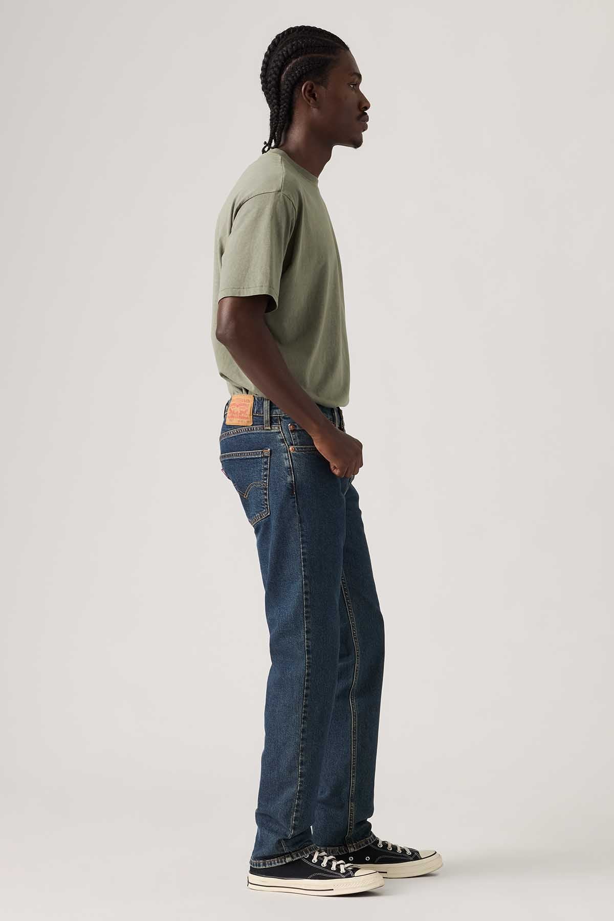 Side view of dark blue denim jeans with straight leg and belt loops
