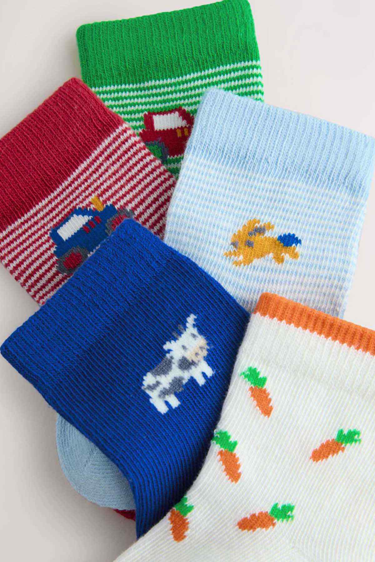 Kids crew socks with green ribbed cuff and animal, car and carrot knit patterns