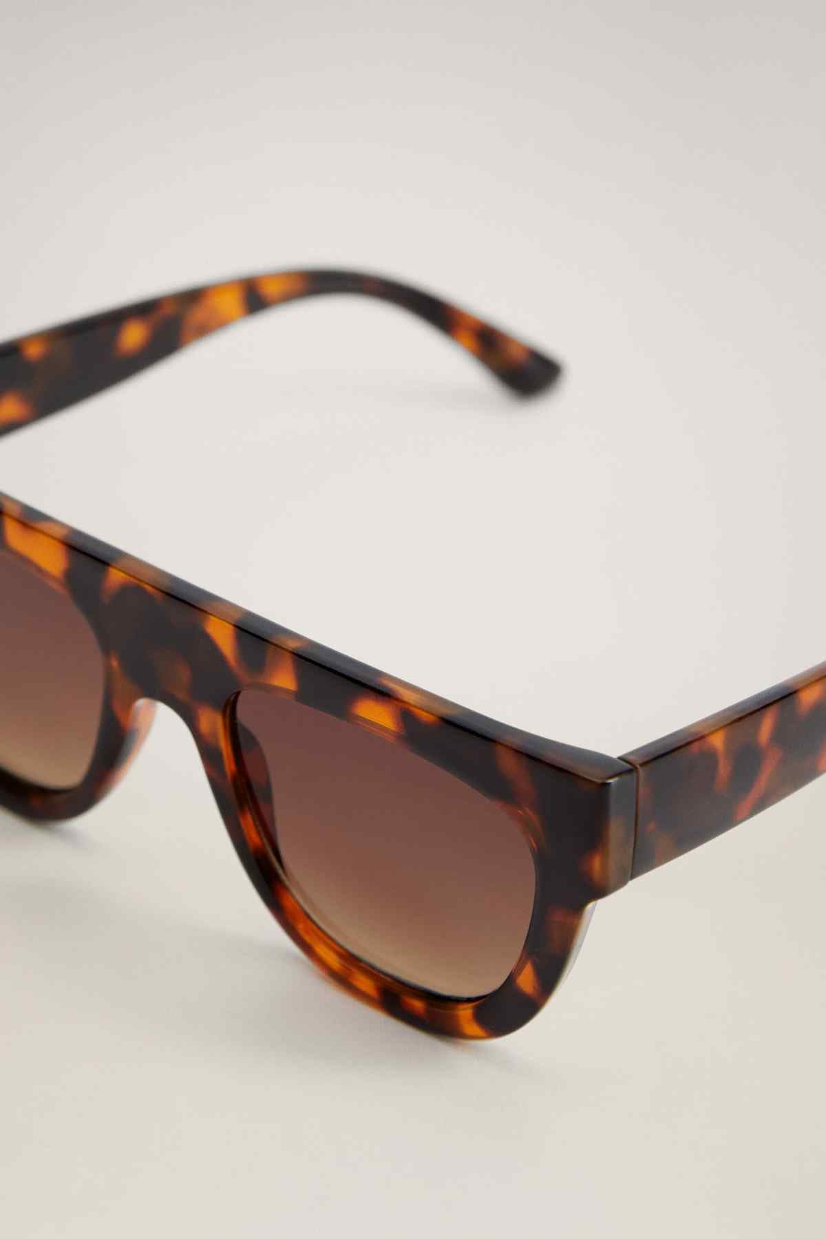 MANGO tortoiseshell sunglasses close-up of frame and dark brown lenses