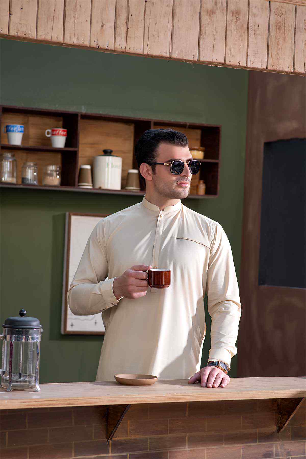 Cream long kurta with mandarin collar and button front, paired with matching pants