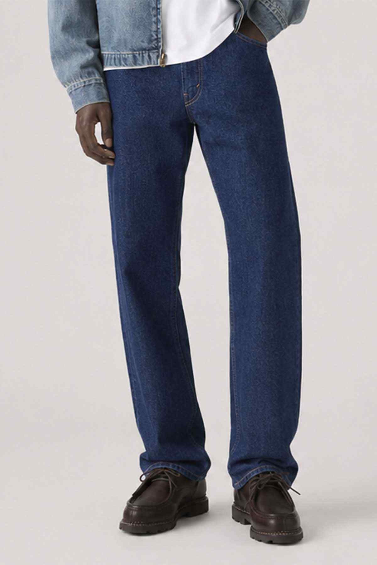 Blue denim jeans close-up with straight legs, front fly, and side pockets