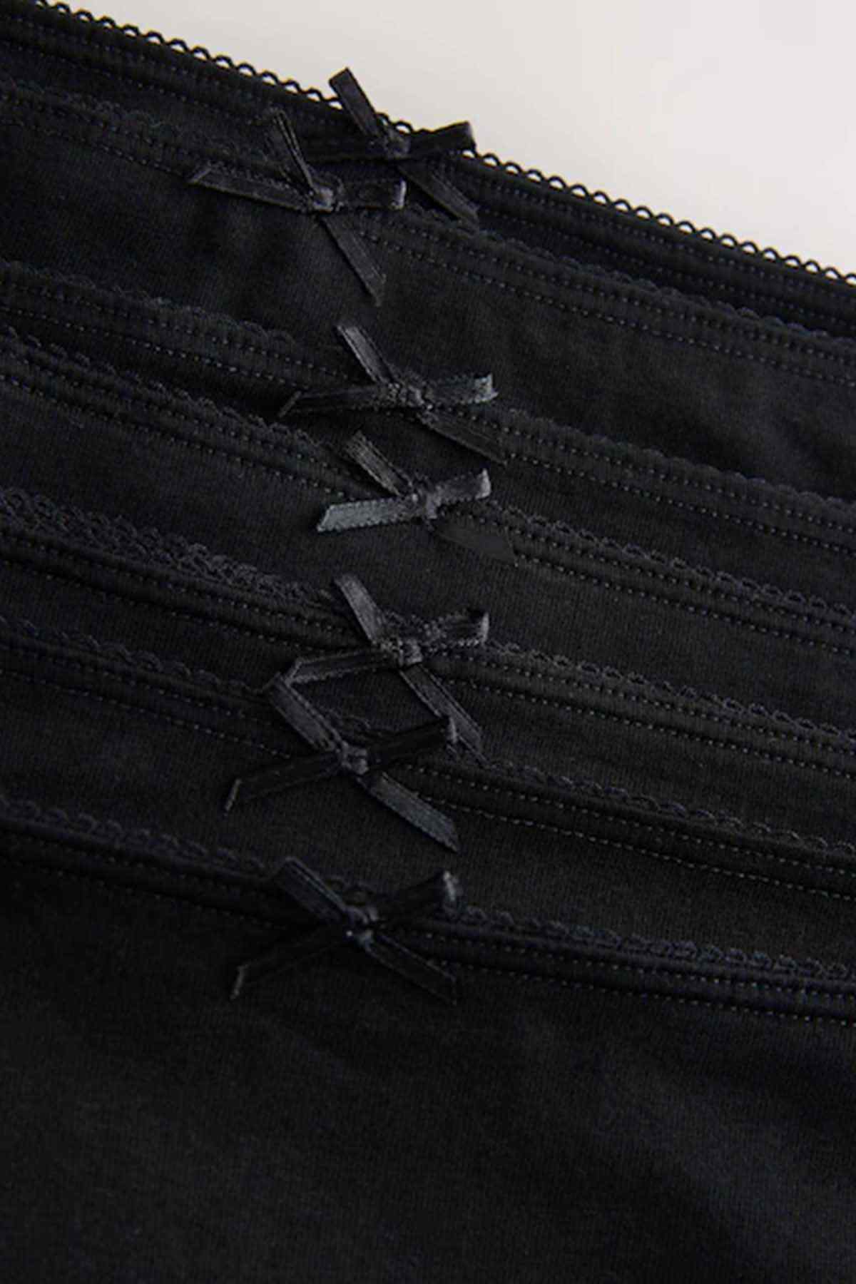 NEXT black briefs close-up, bow accents with layered lace and elastic trim