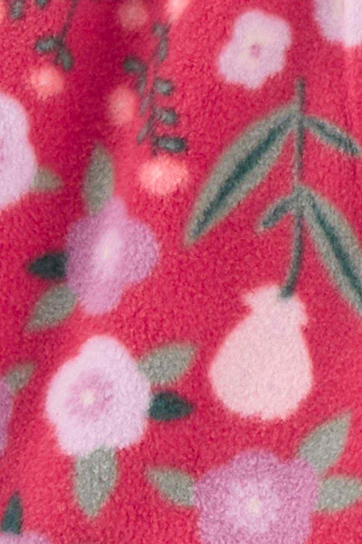 Close-up of multicolor floral fleece fabric with white shapes on pink