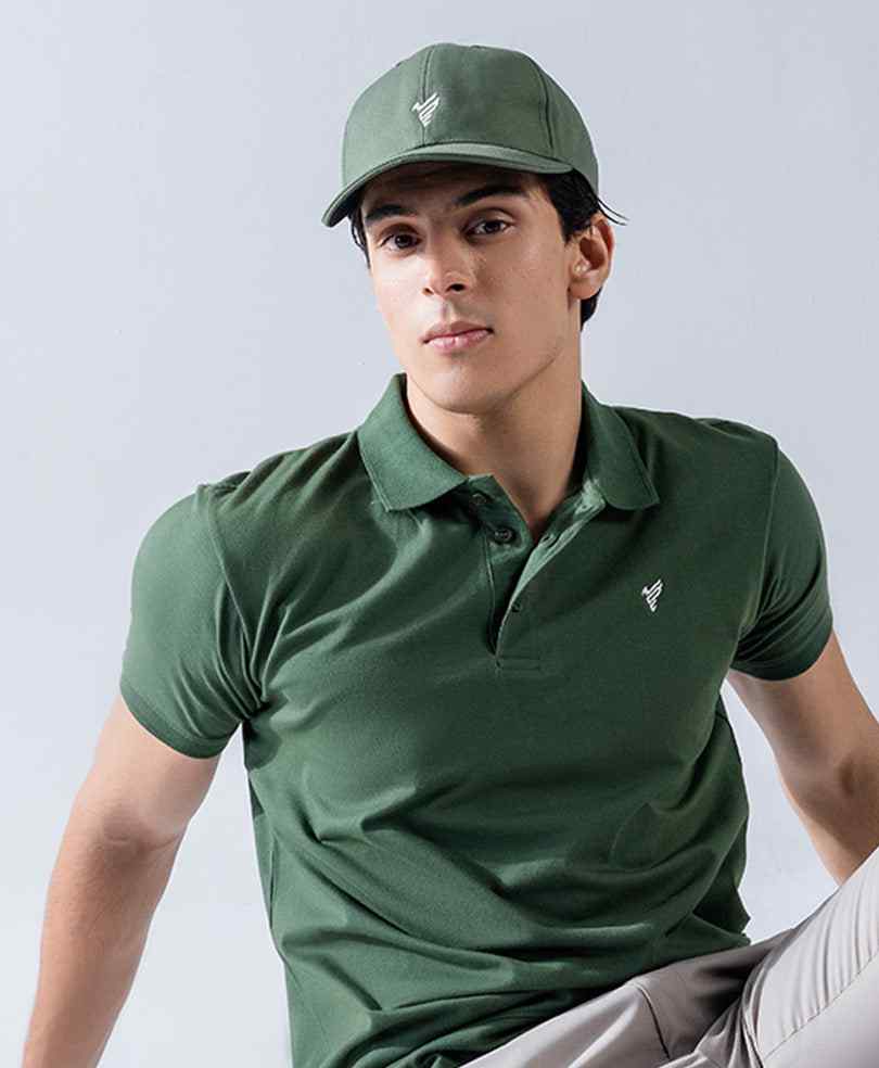 Close-up of fitted dark green polo shirt with collar and small chest logo.
