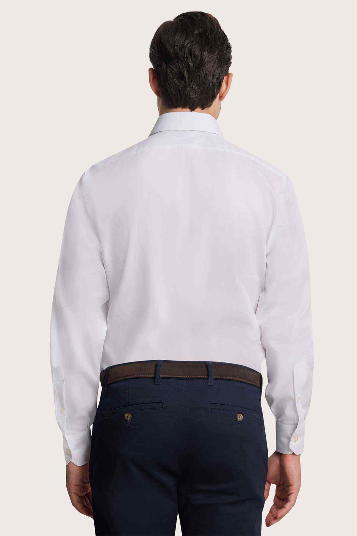 Back view of men's white button-up dress shirt with long sleeves