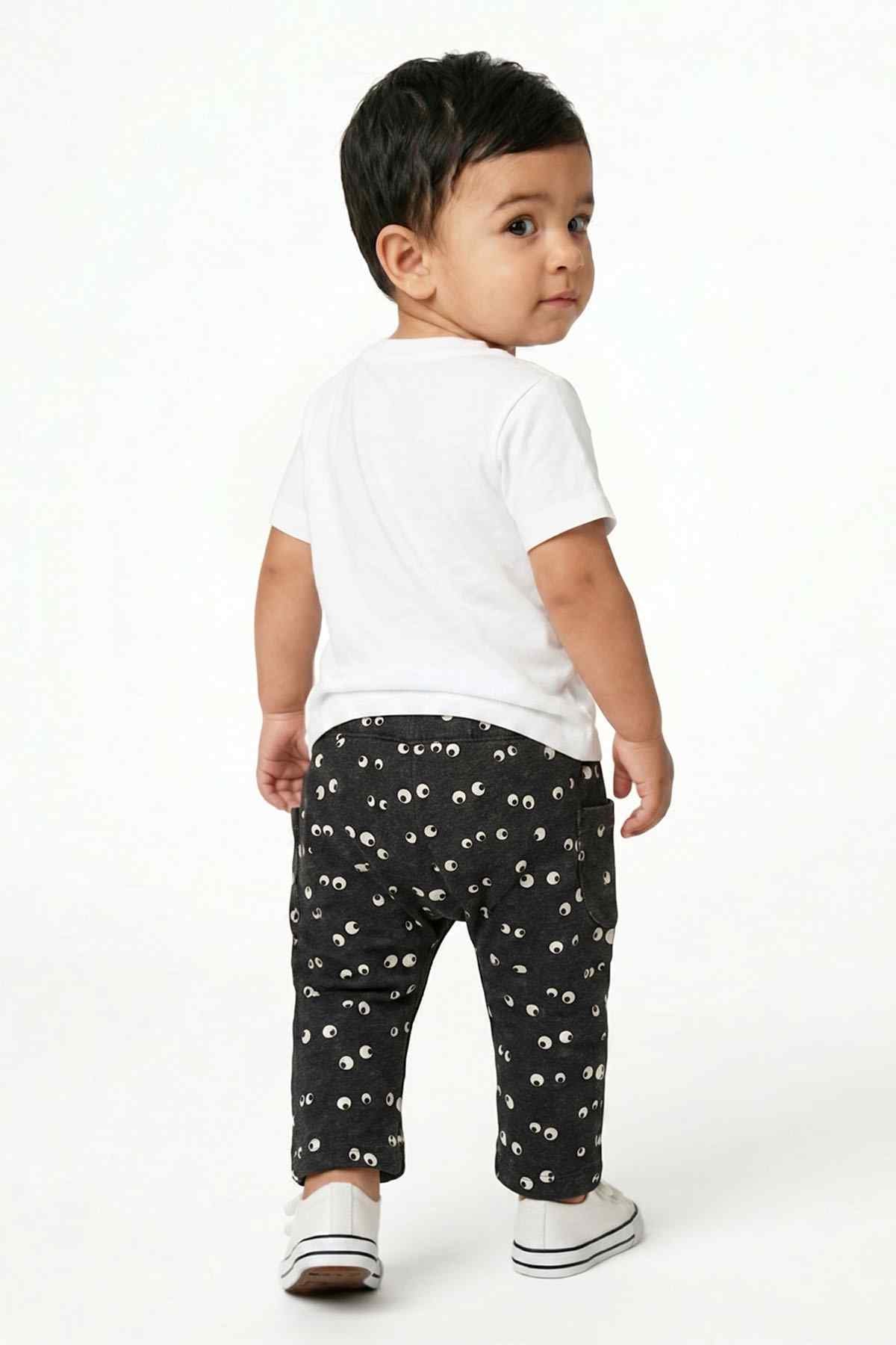 Dark navy baby pants with white eye print and elastic waist