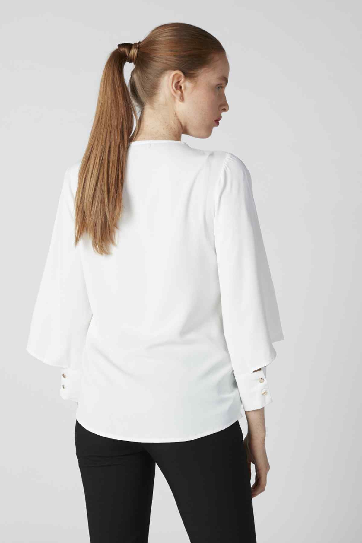 Splash blouse back view, white with three-quarter flared sleeves and buttoned cuffs