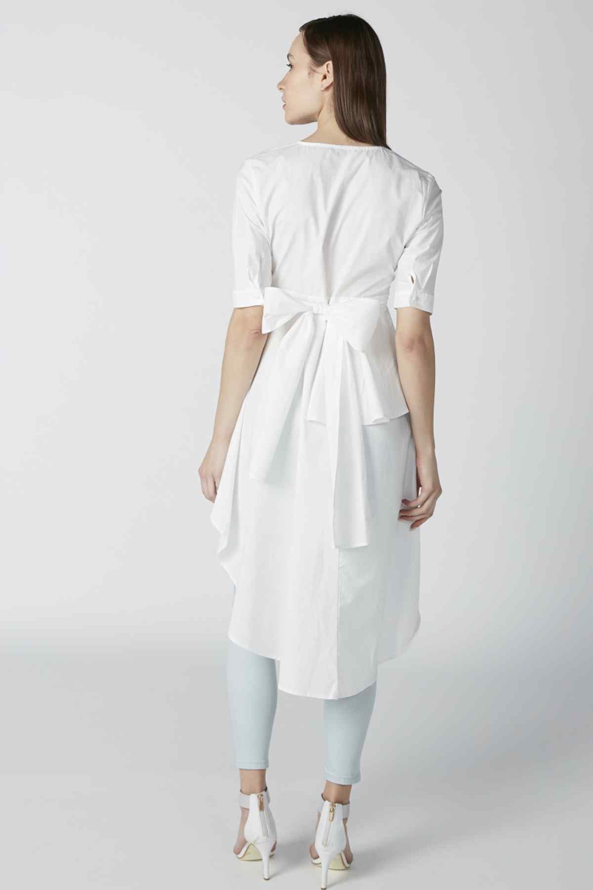 White tunic back view with tie waist and asymmetrical hem, 3/4 sleeves