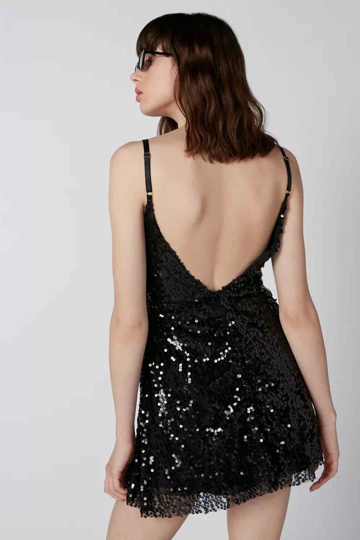 Black sequin mini dress with open-back V and spaghetti straps
