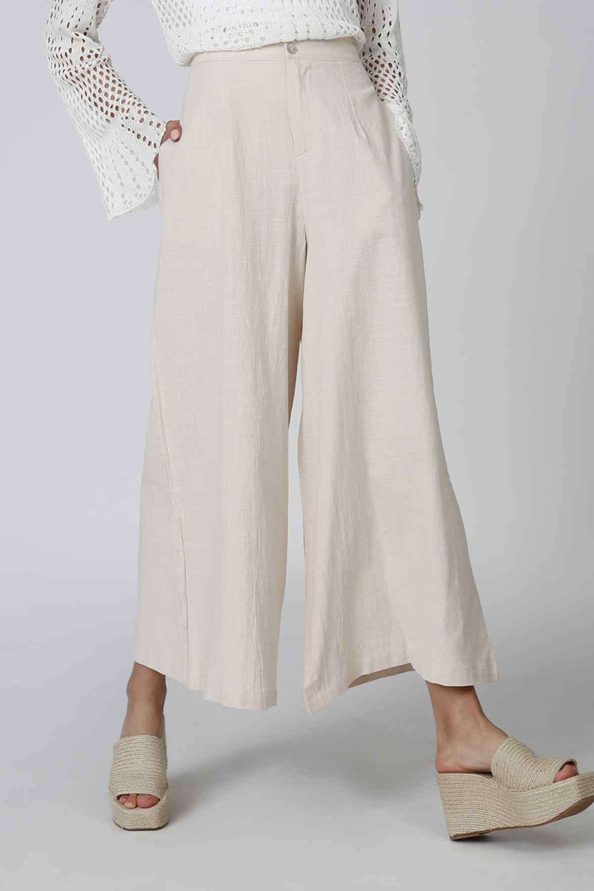 Beige wide-leg pants with front crease and straight cropped hem