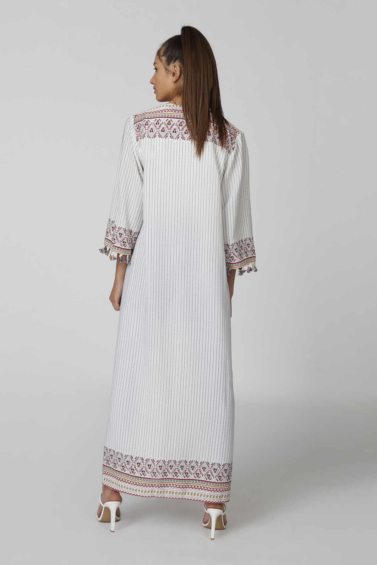 Long striped caftan dress with multicolor embroidered cuff and hem trim, side view