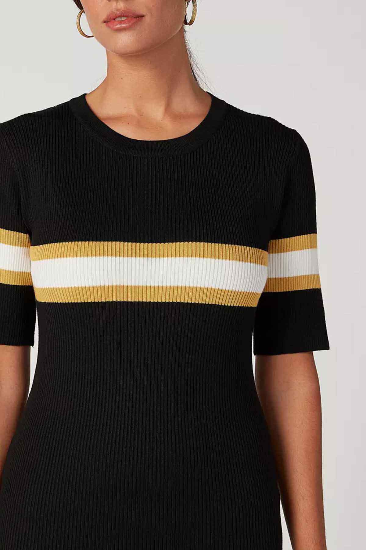 Black ribbed knit dress close-up: crewneck and white/yellow striped chest band