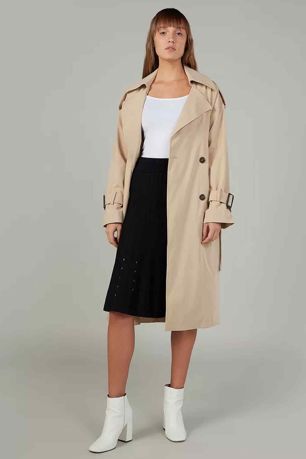 Black pleated midi skirt with elastic waistband, knee to mid-calf length