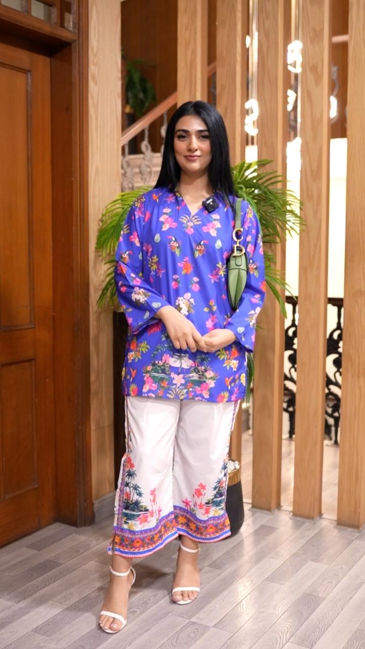 Blue floral printed long kurta with white pants, front view, round neckline
