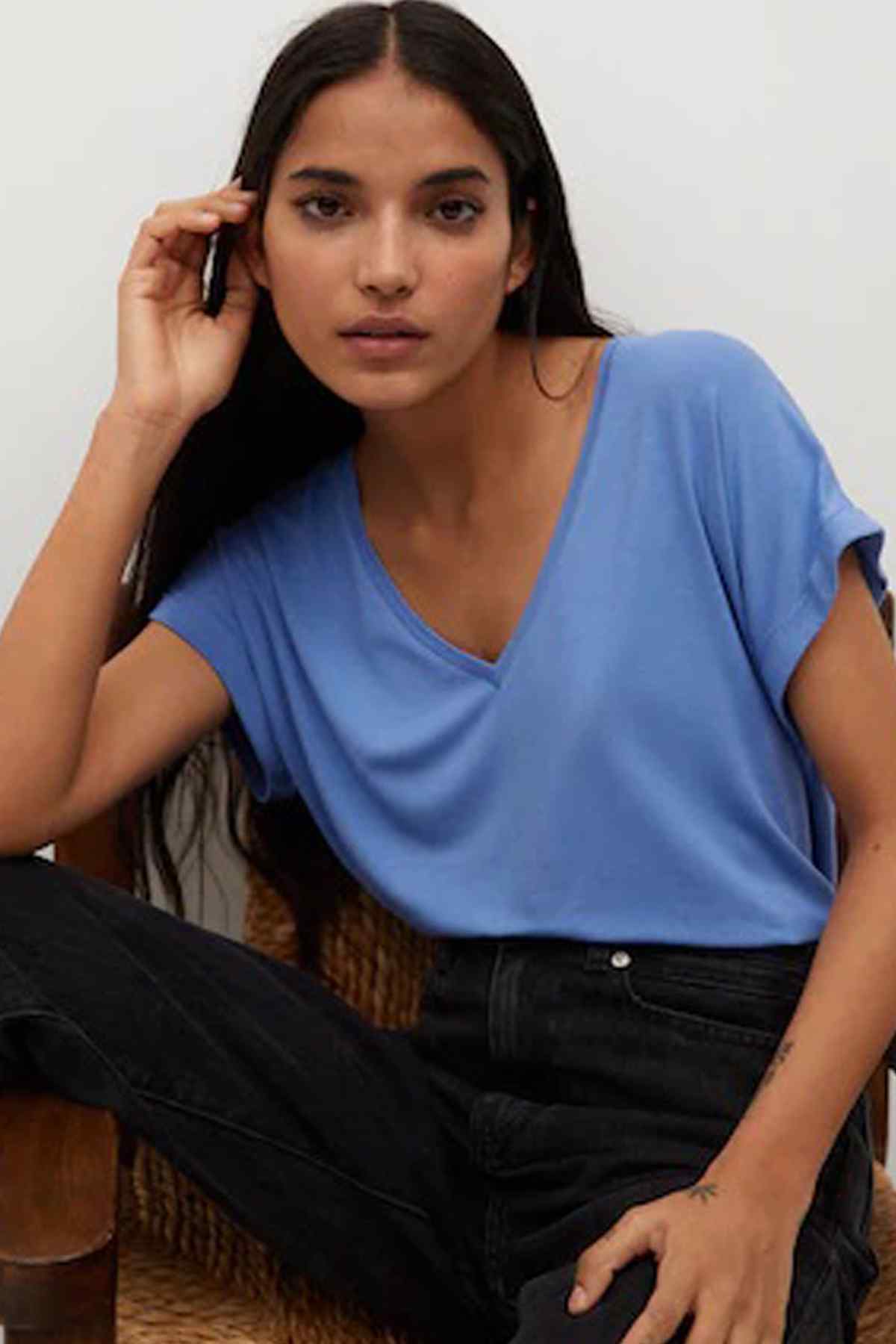 Blue V-neck short-sleeve top with V neckline and draped sleeves