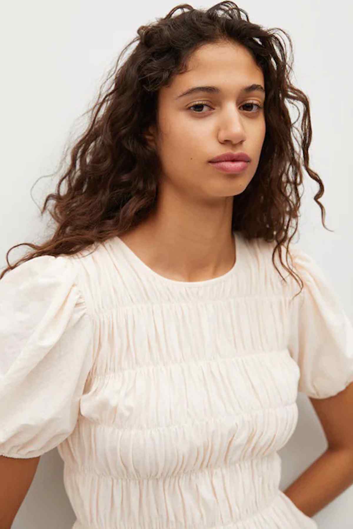 Vanilla peplum blouse close-up with smocked bodice and puff sleeves