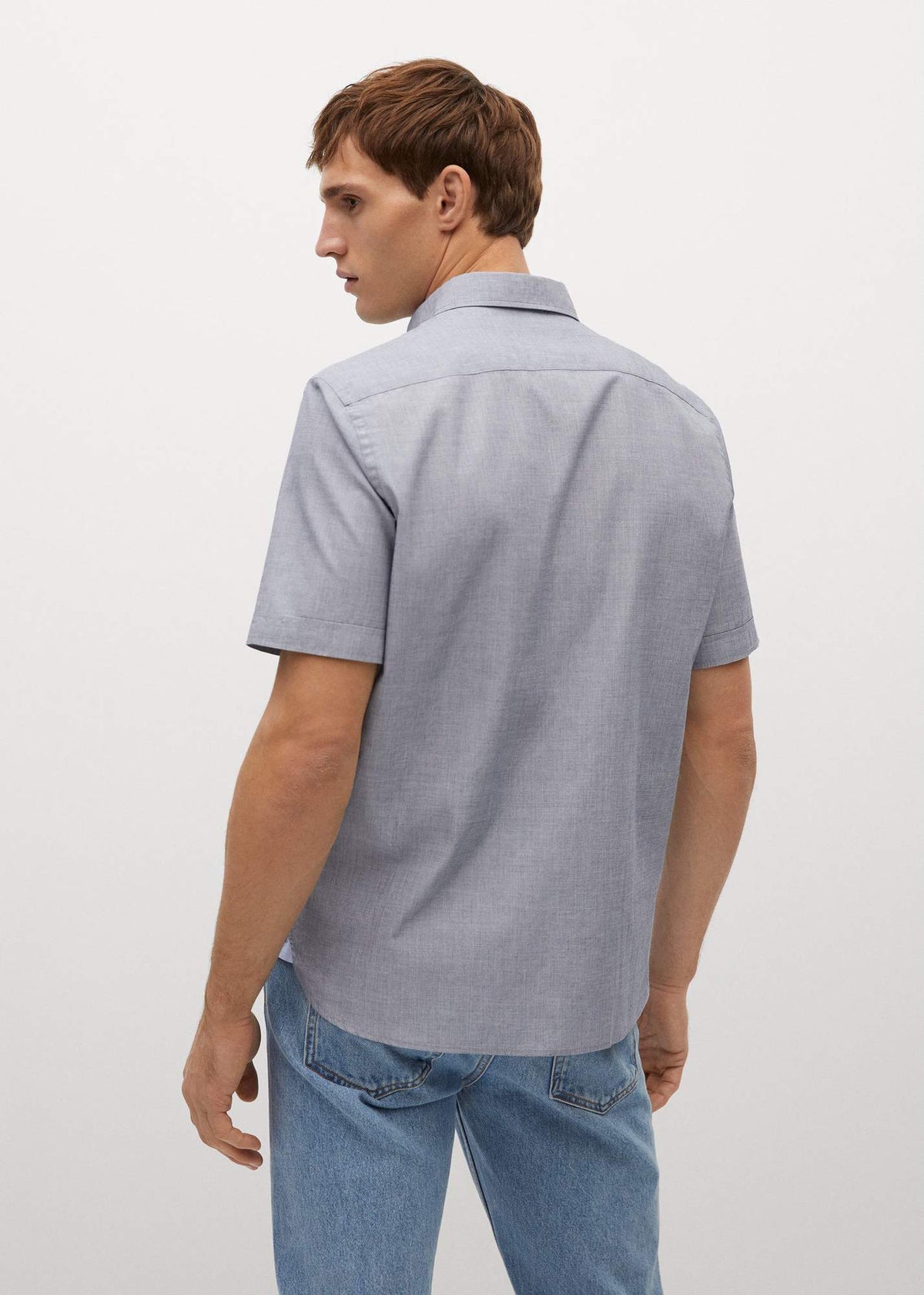 Mens short-sleeve button-up shirt, light blue, back view with short sleeves and collar