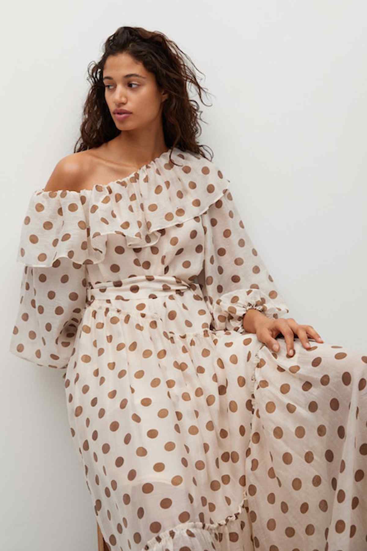 Ecru polka-dot off-shoulder dress with ruffled neckline and belted waist detail