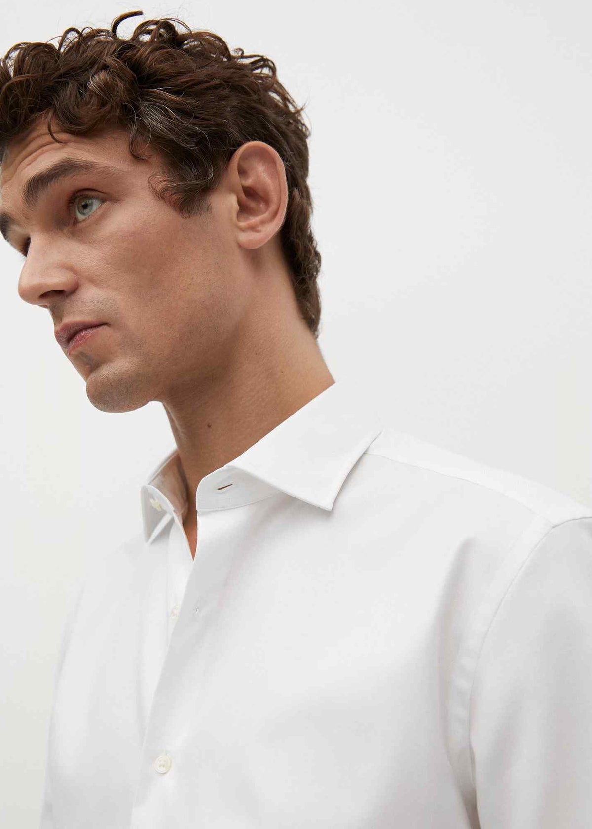 Men's white dress shirt close-up with button placket and point collar